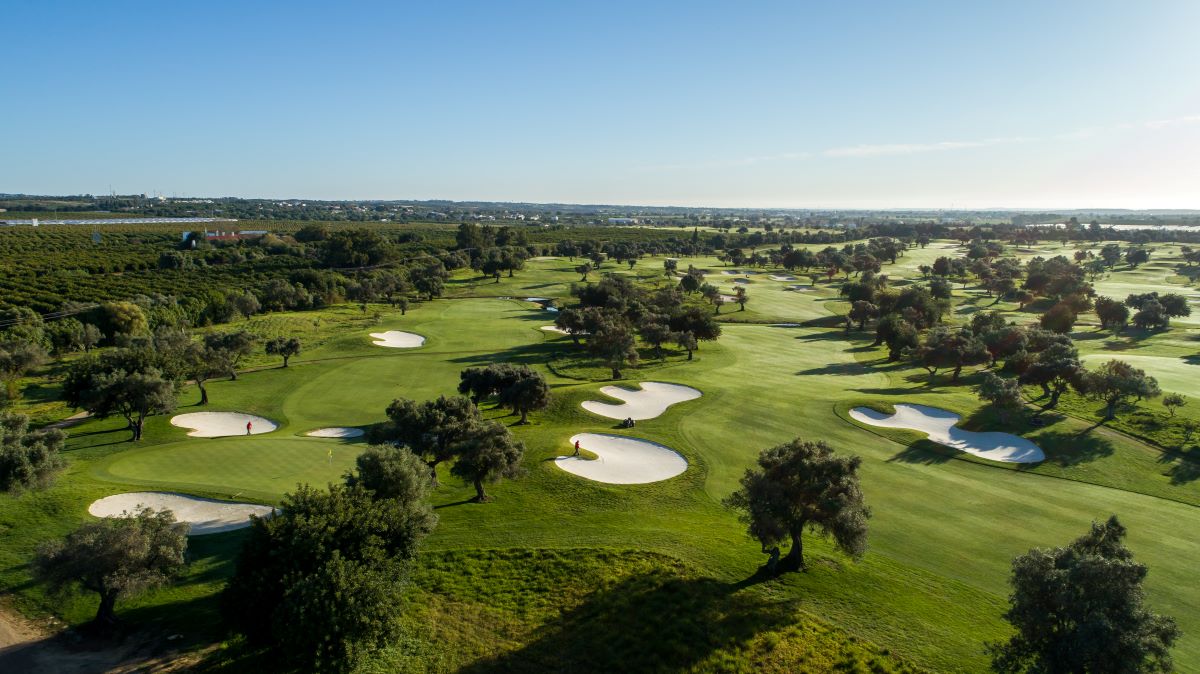 Blue sky over green fairways at Quinta Da Ria Golf Club Ria Course