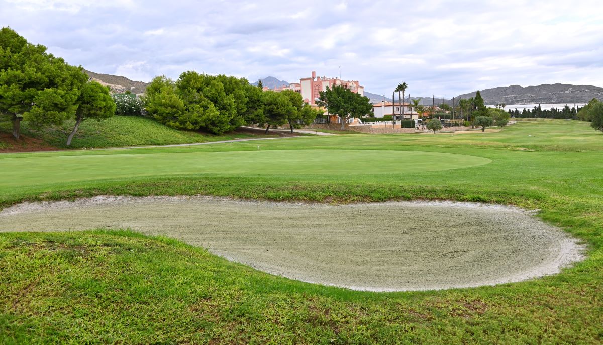 Large bunker with putting green in distance at Bonalba golf course