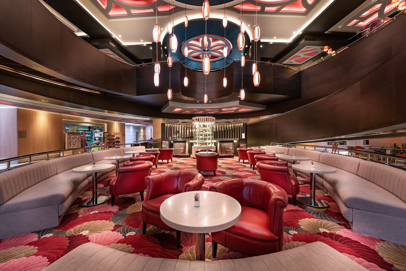 Red chairs in bar area at Cornelia Diamond Resort