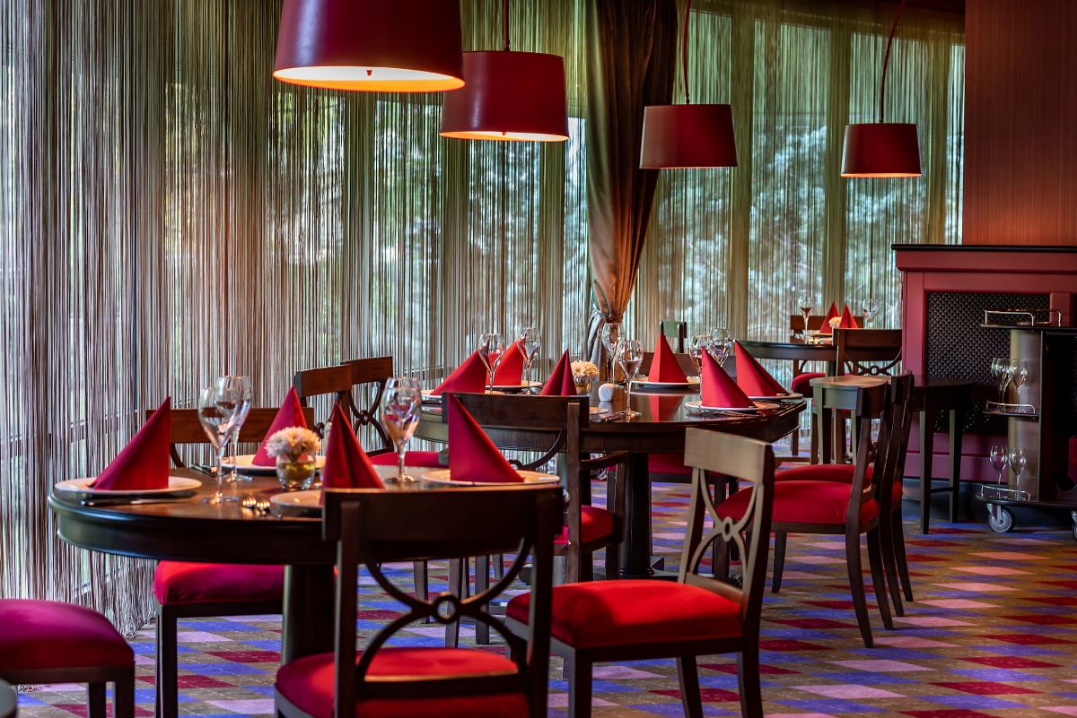 Chairs in dining area at Cornelia Diamond, with red tops