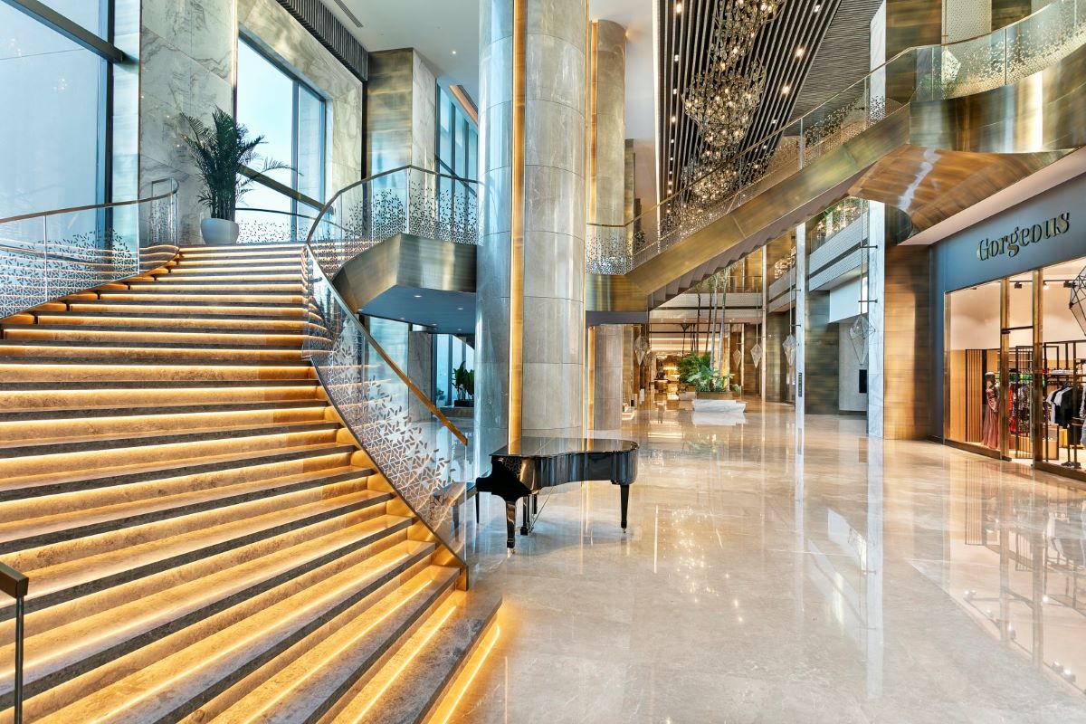 Piano at foot of staircase at Cullinan Belek Resort