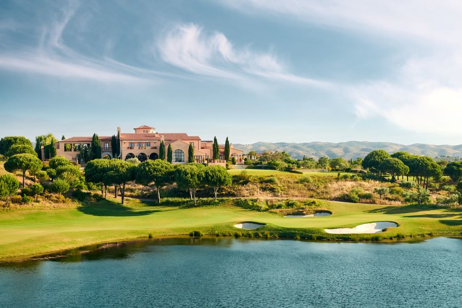 Clubhouse at Monte Rei Golf & Country Club overlooking the blue lake