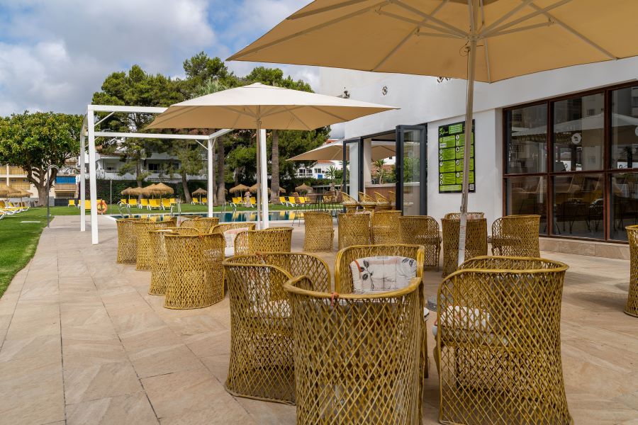 Outdoor seating area in the bar at THB San Fermin Benalmadena