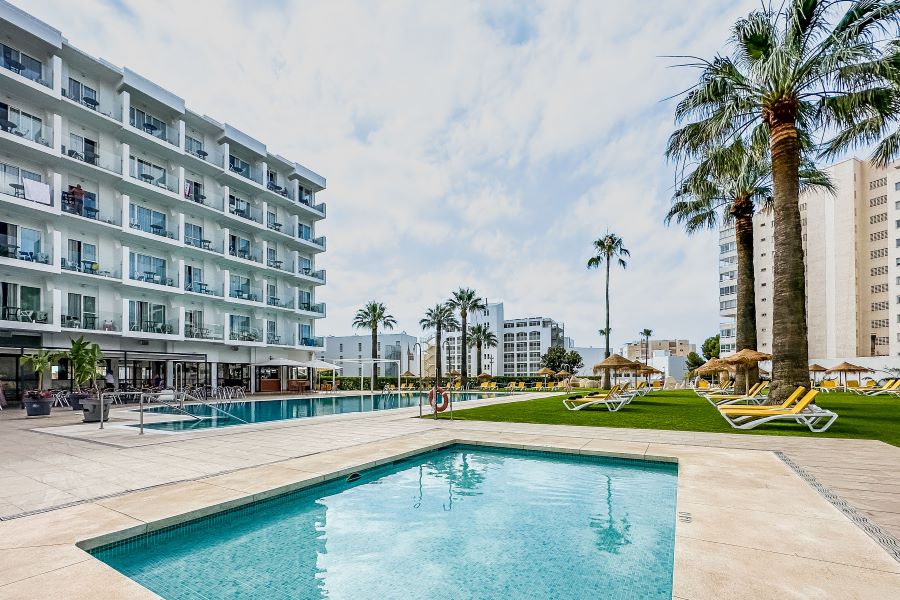 THB San Fermin Benalmadena outdoor swimming pool with palm trees overlooking