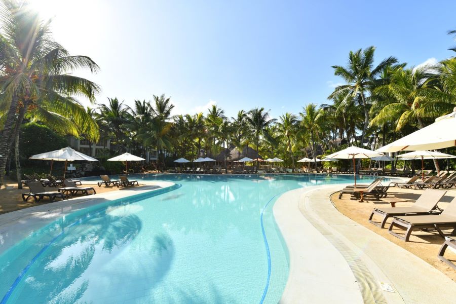 Trees overhanging the swimming pool at Canonnier Beachcomber Golf Resort & Spa