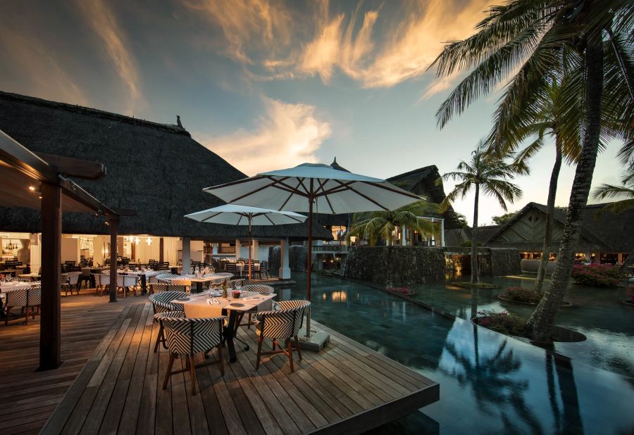 Dining area overlooking pool at Constance Belle Mare Plage Hotel Mauritius