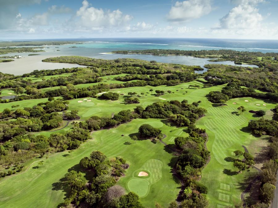 Numerous holes at the Links Course in Mauritius, with the Indian Ocean in the distance