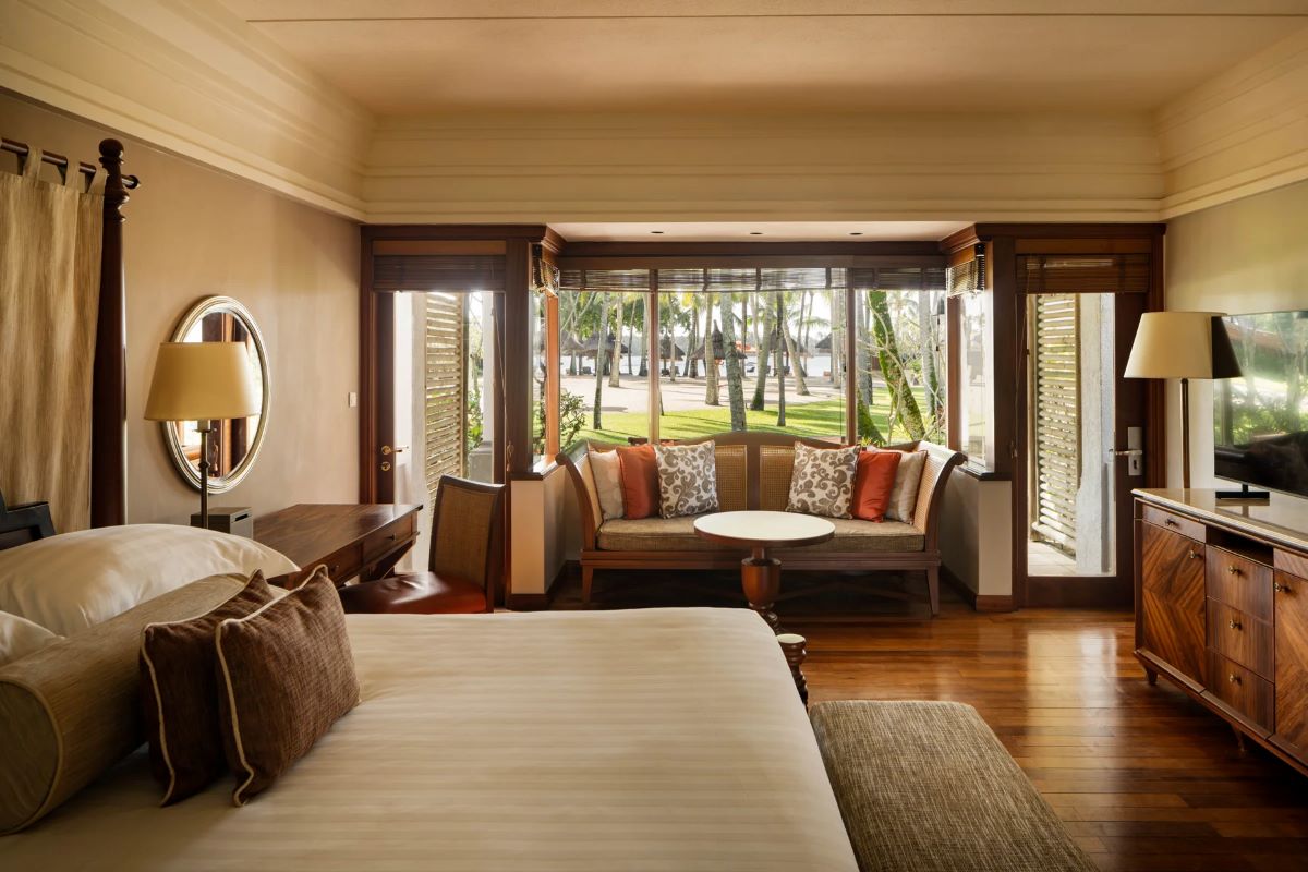 Bedroom with window and seating area at Constance Prince Maurice