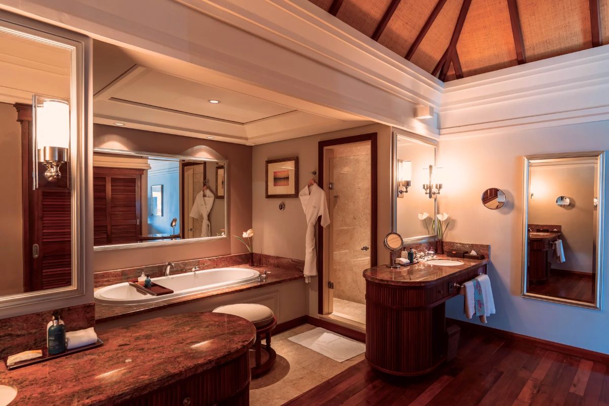 Bathroom with bath tub in room at Constance Prince Maurice