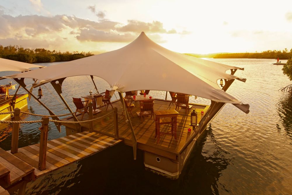 Decked area under huge parasol over water at Constance Prince Maurice