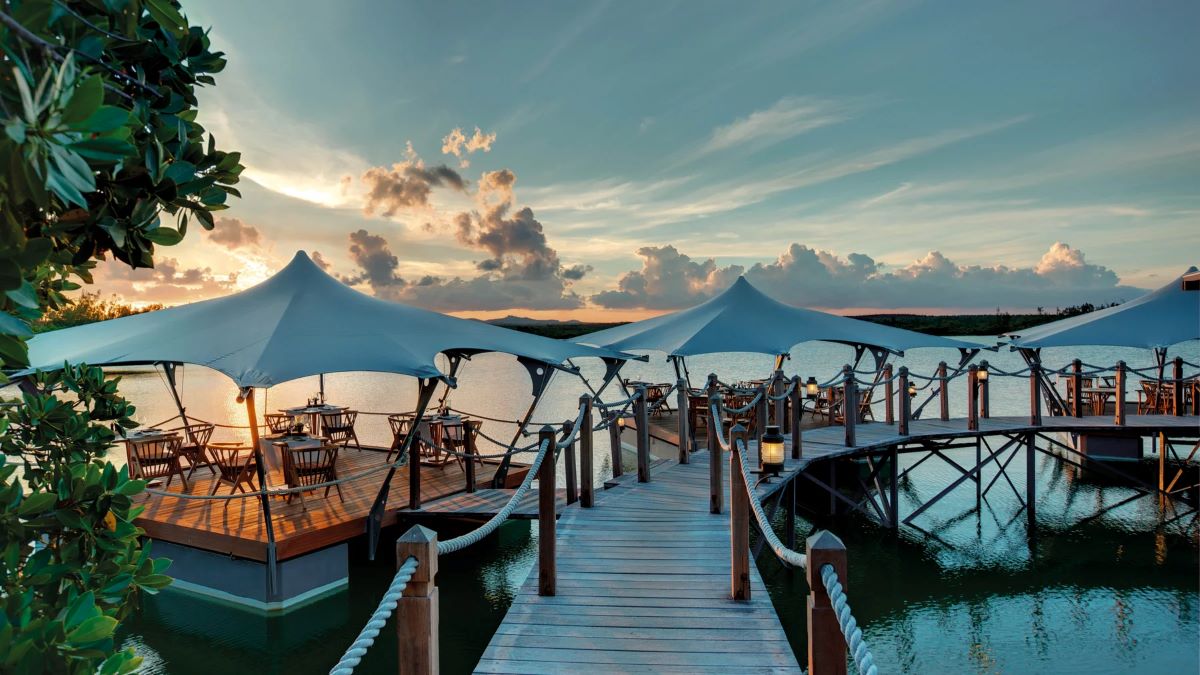 Board walk to seating area on decking at Constance Prince Maurice