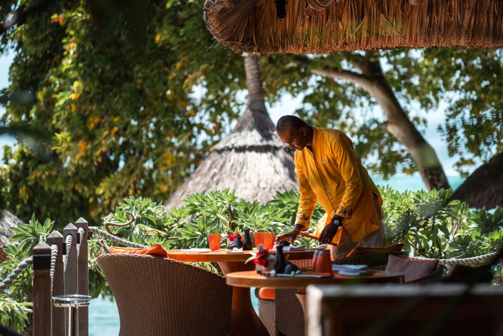 Waiter laying table at Constance Prince Maurice