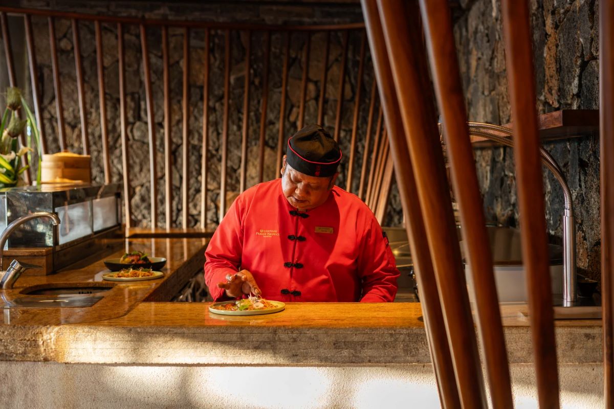 Chef in open kitchen at Constance Prince Maurice