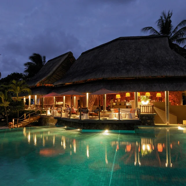 Restaurant lit up at night at Constance Prince Maurice