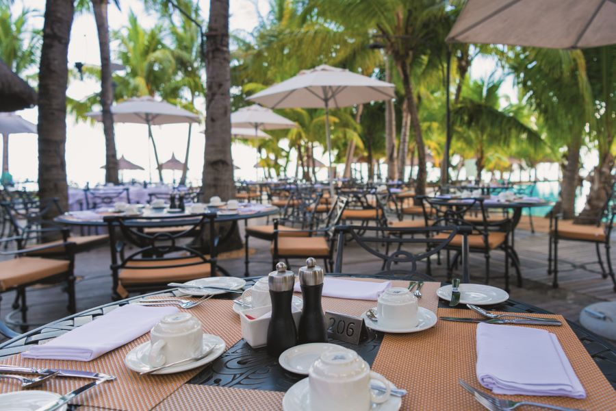 Restaurant with al fresco dining ready for service at Dinarobin Beachcomber Golf Resort & Spa