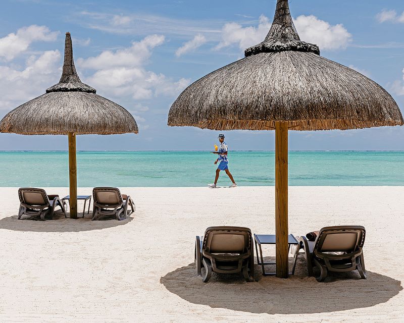 Sun loungers on beach at Four Seasons Resort Mauritius at Anahita