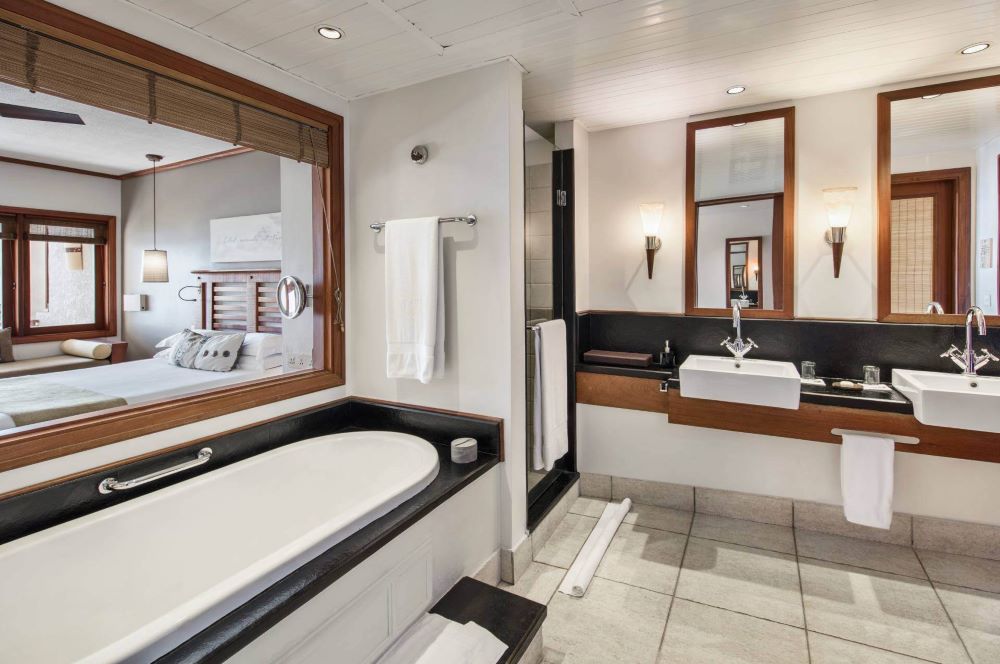 Bathroom with sink and tub at Heritage Awali Golf & Spa Resort