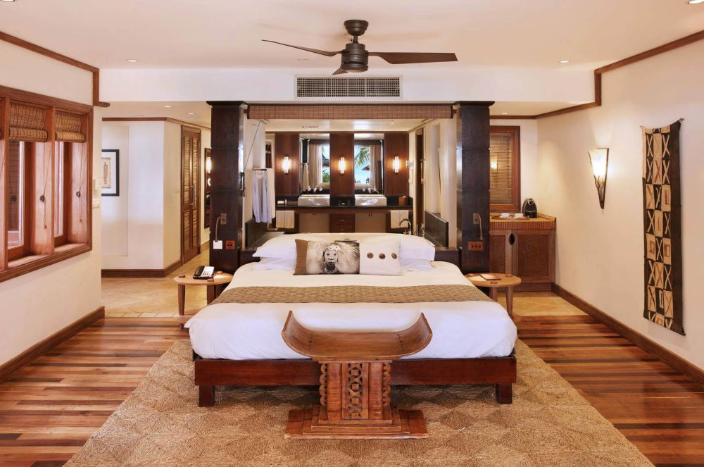 Large bed in centre of room at Heritage Awali Golf & Spa Resort