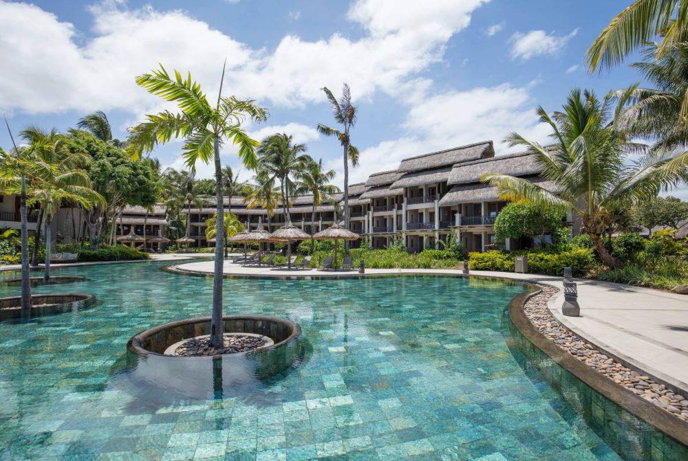 Swimming pool overlooked by the accommodation at Heritage Awali Golf & Spa Resort