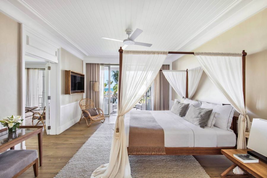 Bedroom with four poster bed at Heritage Le Telfair Golf & Wellness Resort in Mauritius