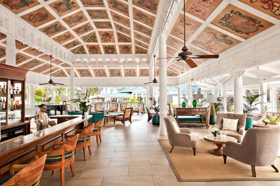 Bar stools by bar at Heritage Le Telfair Golf & Wellness Resort in Mauritius