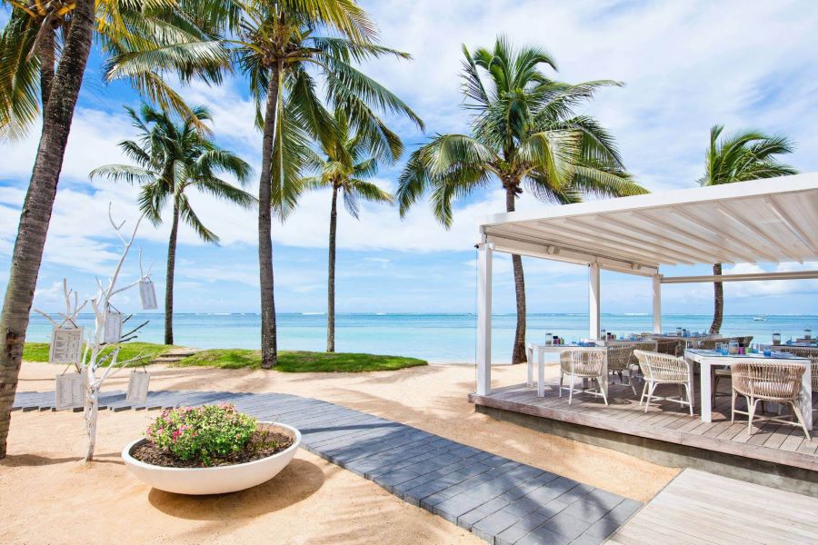 View of beach from cafe at Heritage Le Telfair Golf & Wellness Resort in Mauritius