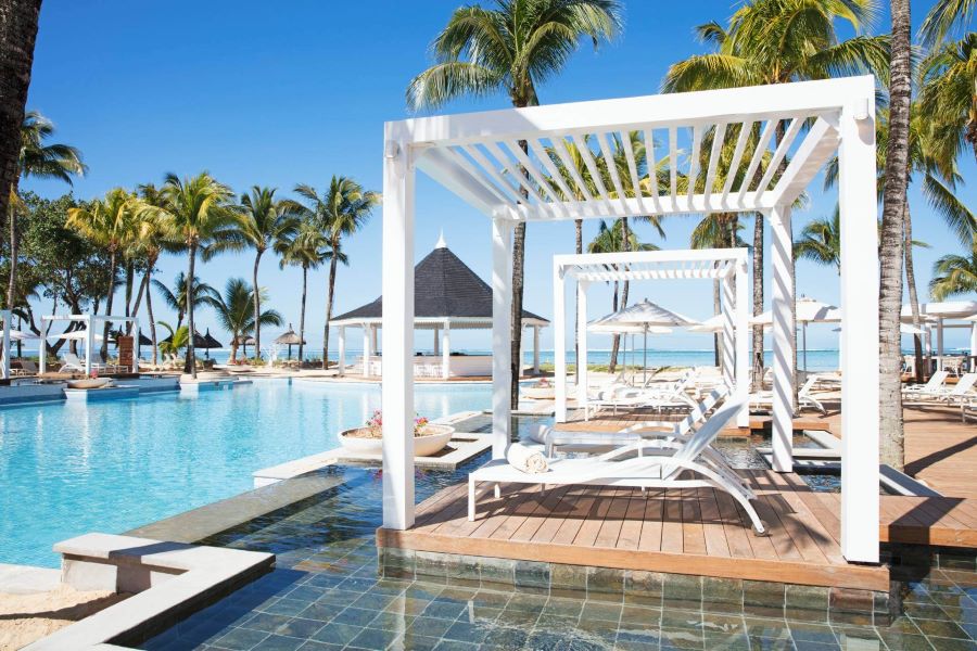 Cabanas by the pool at Heritage Le Telfair Golf & Wellness Resort in Mauritius