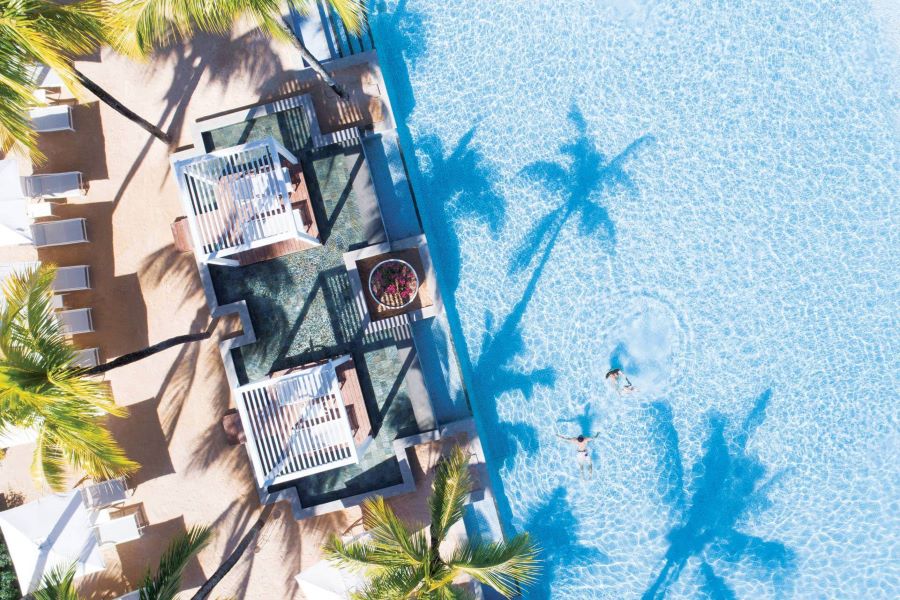 Cabanas by the pool at Heritage Le Telfair Golf & Wellness Resort in Mauritius