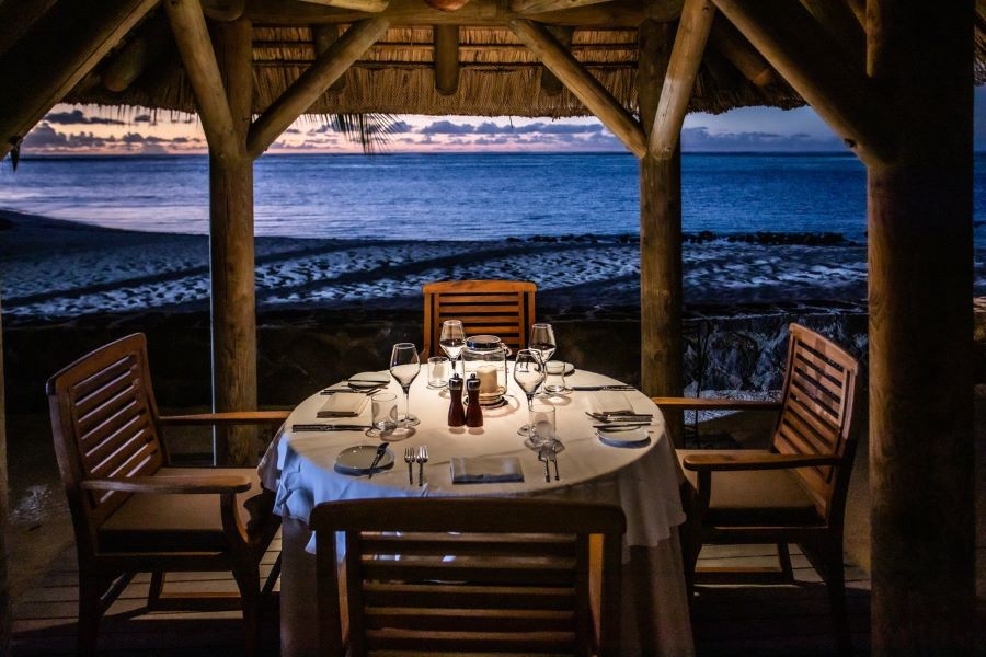 Evening dining with table set at Paradis Beachcomber Golf Resort & Spa