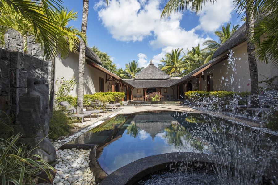 Spa treatment rooms with pool in middle at Paradis Beachcomber Golf Resort & Spa