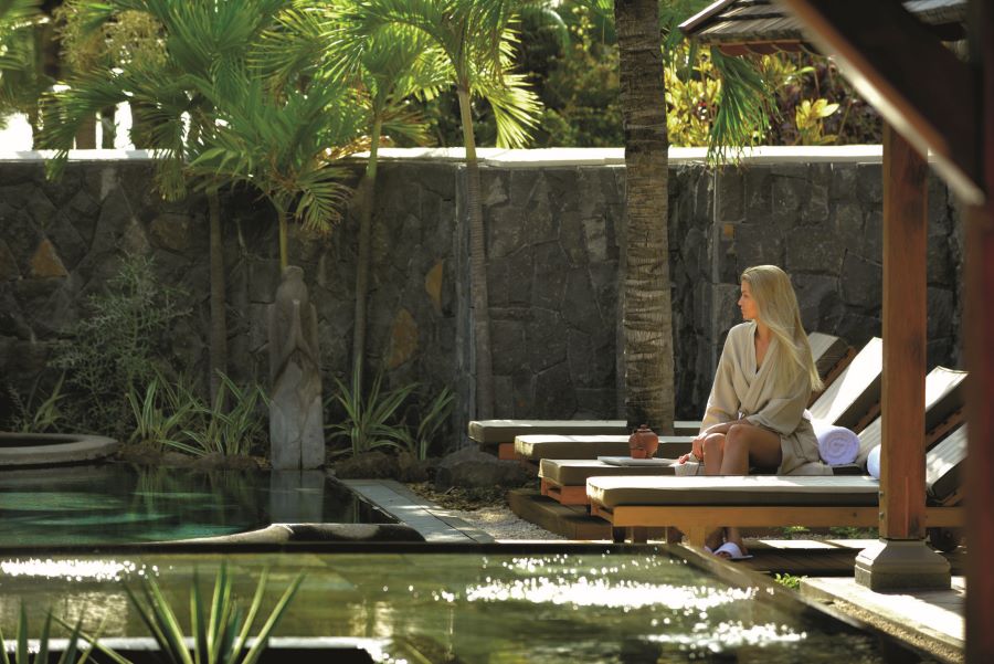 Guest relaxing on lounger in spa at Paradis Beachcomber Golf Resort & Spa