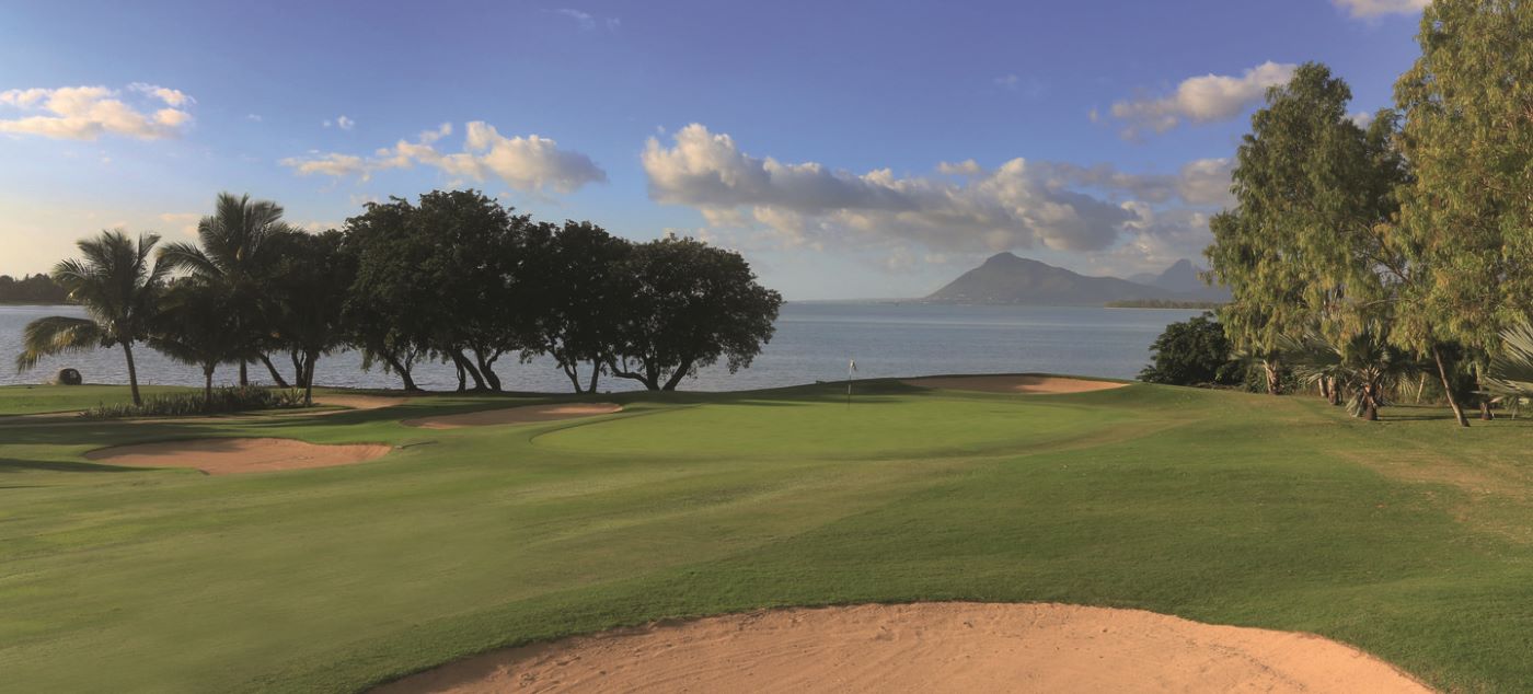 Three trees and a bunker either side of the fairway at Paradis Golf Club