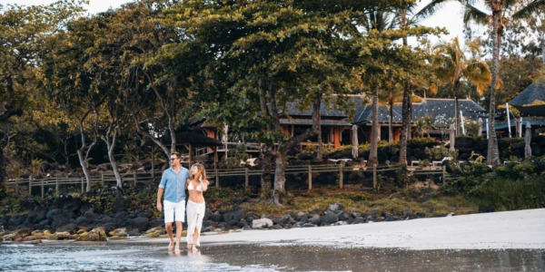 Couple walking on the beach at Tamarina Golf & Spa Boutique Hotel