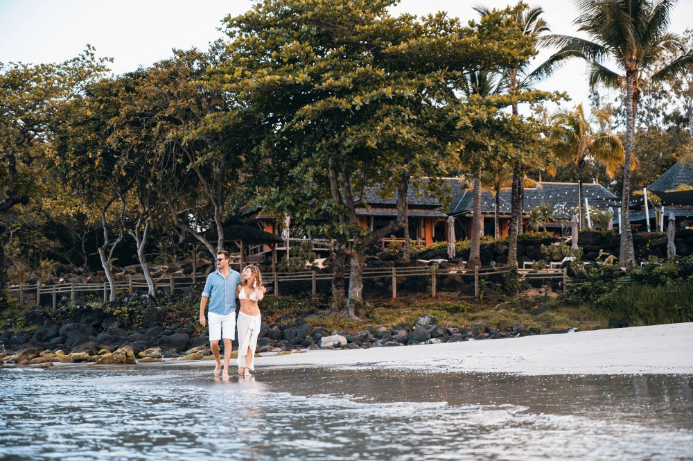 Couple walking on the beach at Tamarina Golf & Spa Boutique Hotel