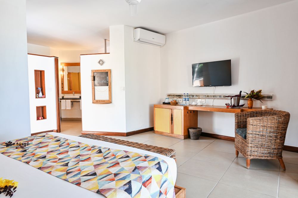 Bedroom with tv mounted wall at Tamarina Golf & Spa Boutique Hotel