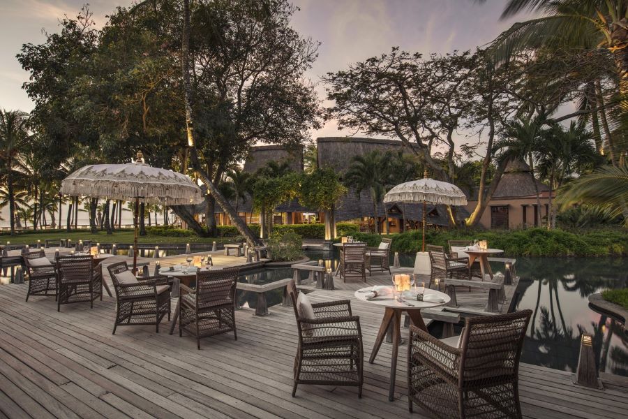 Table and chairs on decking at Trou aux Biches Beachcomber Golf Resort & Spa