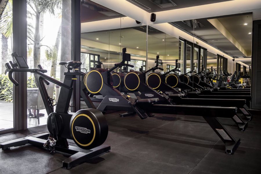 Gym with treadmills and bikes at Trou aux Biches Beachcomber Golf Resort & Spa