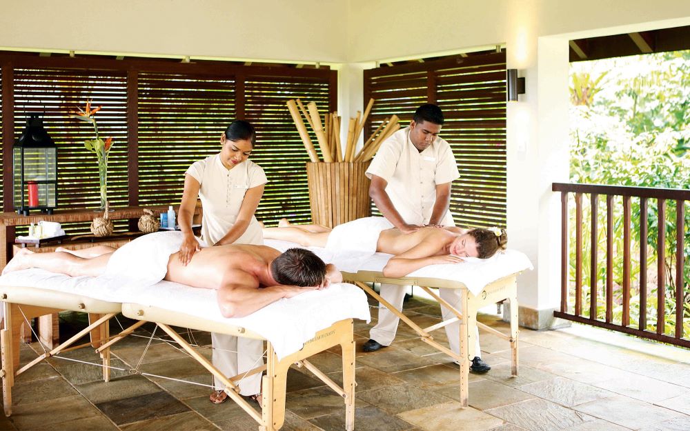 Spa treatment tables with a couple having massages at Anahita Golf And Spa Resort