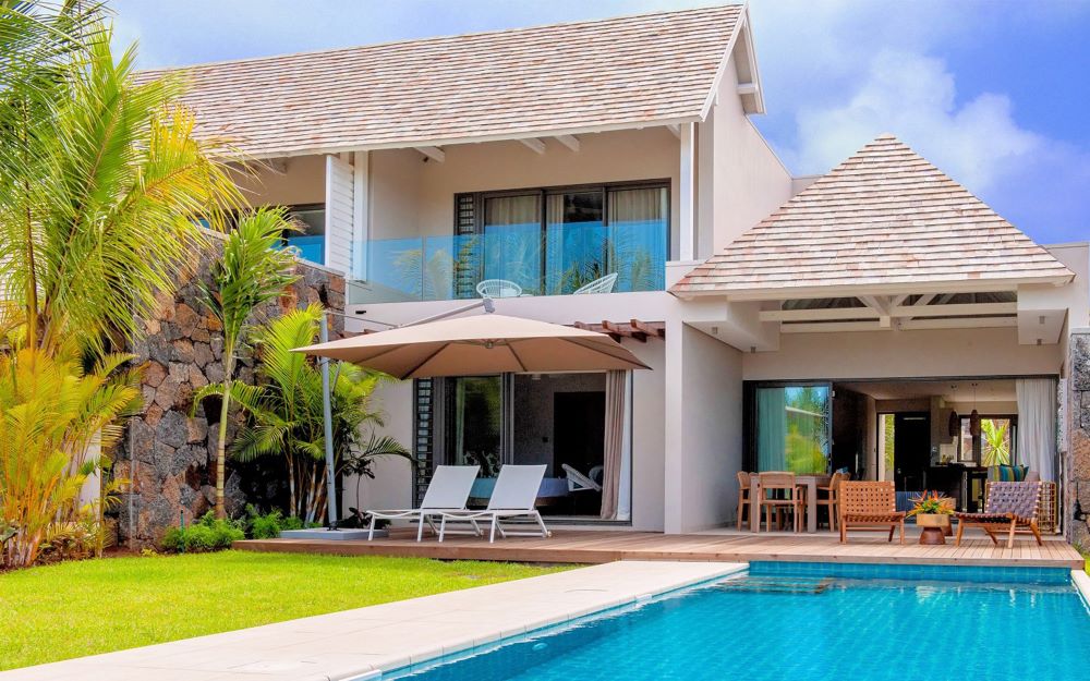 Exterior of room with swimming pool access at Anahita Golf And Spa Resort in Mauritius