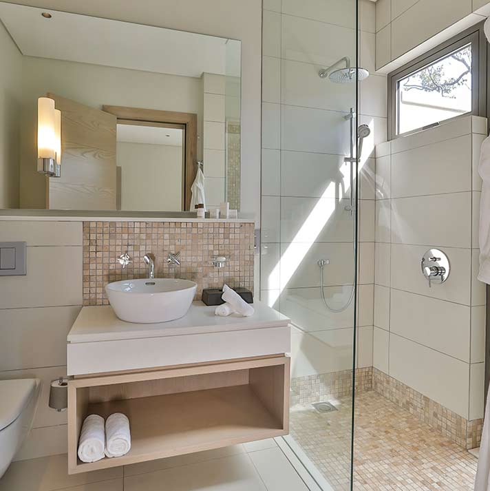 Bathroom with shower and basin at Anahita Golf And Spa Resort