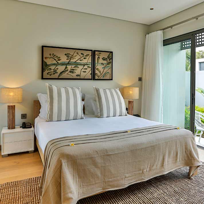 Double bed in guest room at Anahita Golf And Spa Resort