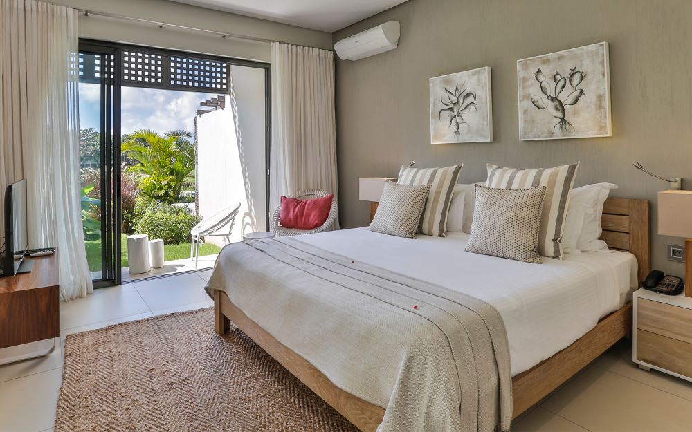 Bedroom with open doors at Anahita Golf And Spa Resort