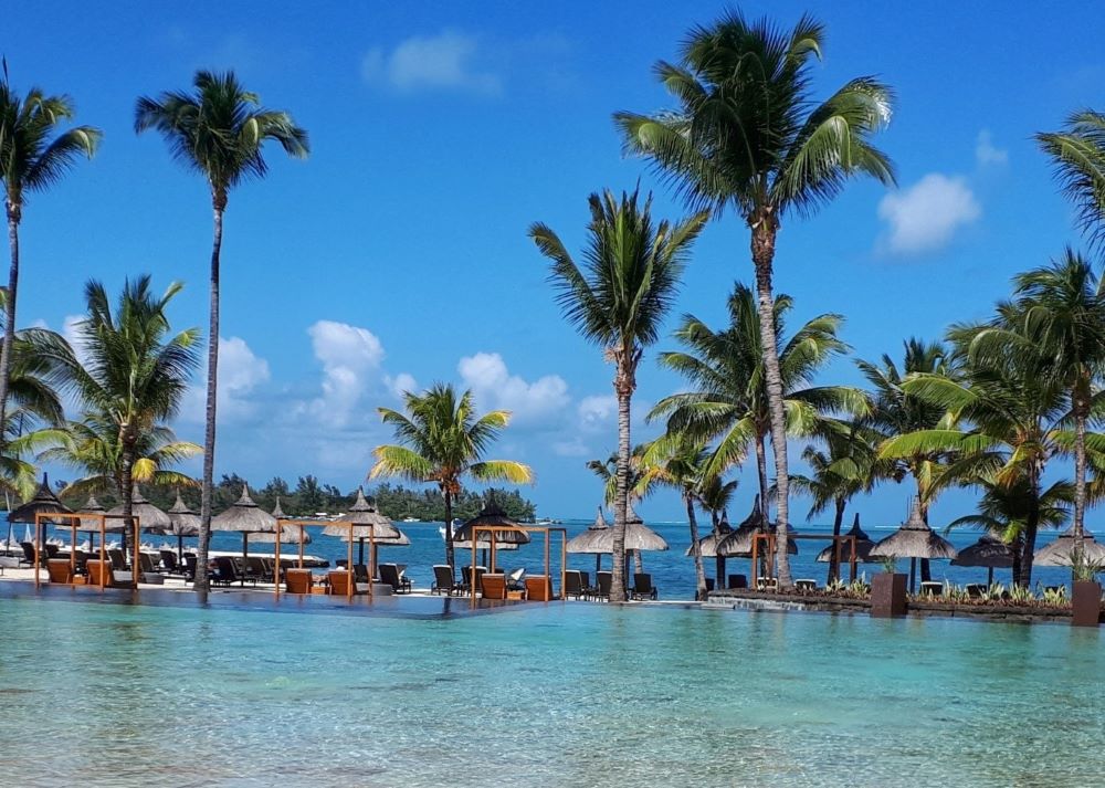 Indian Ocean in the distance of the pool at Anahita Golf And Spa Resort