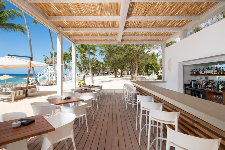 Beach bar with white stools at Casa de Campo Resort & Villas