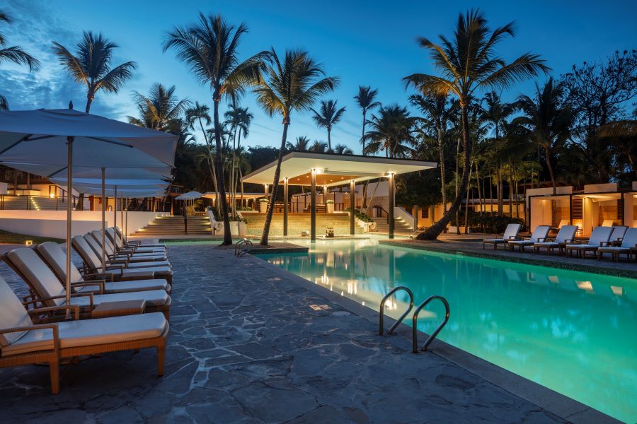 Swimming pool lit up in the evening at Casa de Campo Resort & Villas