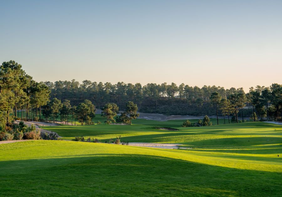 Green grass and blue sky over Dunas Comporta golf course