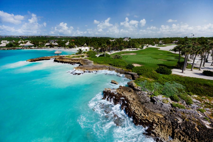 Turquoise water frothing against the rocks by the golf course at Punta Espada in Dominican Republic