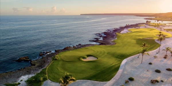 Punta Espada Golf Club in Dominican Republic with the sun setting in the background