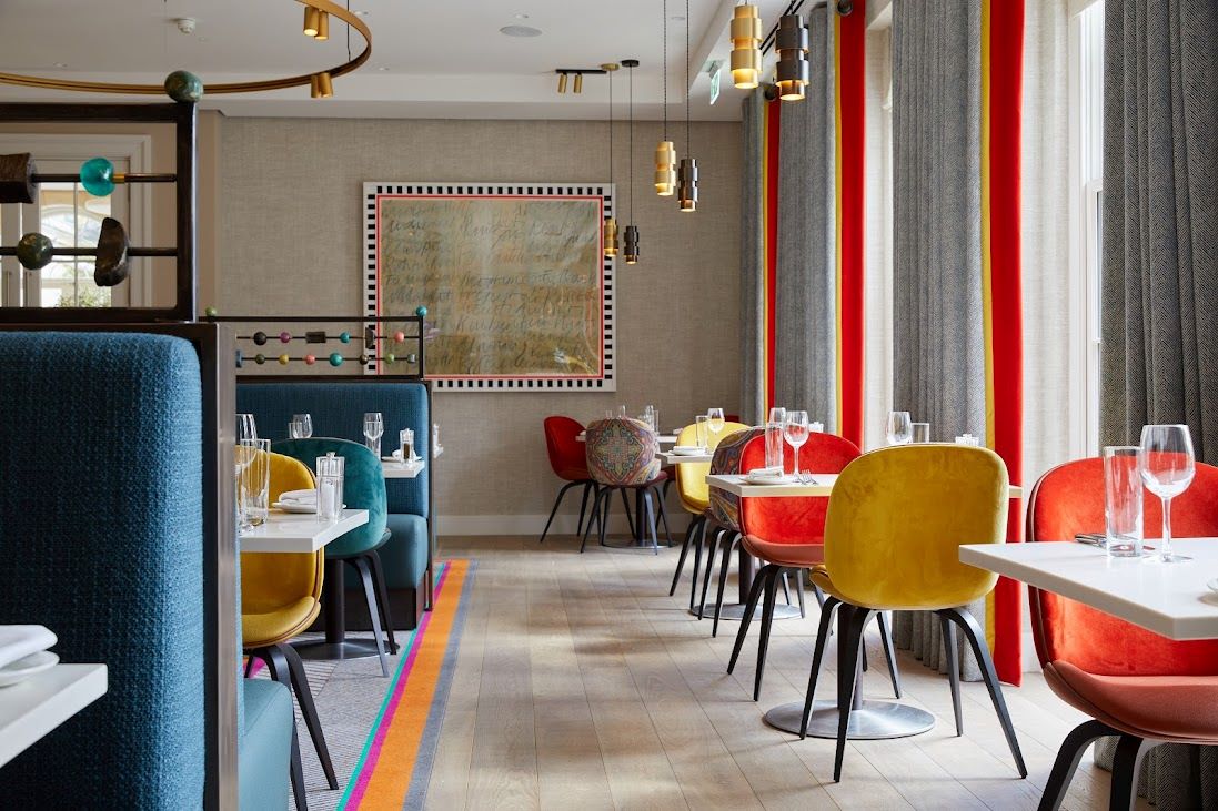 Restaurant at Rudding Park in Harrogate with multi-coloured chairs