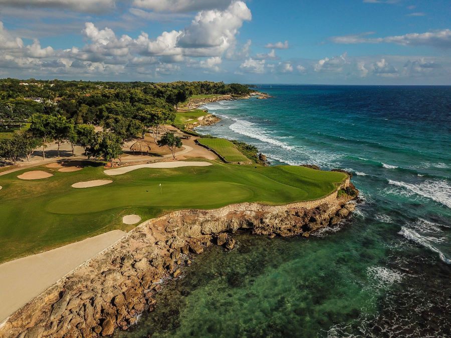 Golf course at Teeth of the Dog sweeping out into the sea and the turquoise water around it